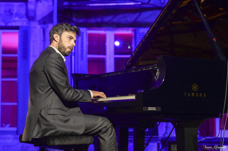 photo of pianist Marc Martin playing the piano at live concert